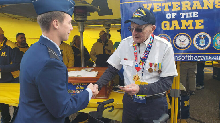 boehle shaking hands with service man