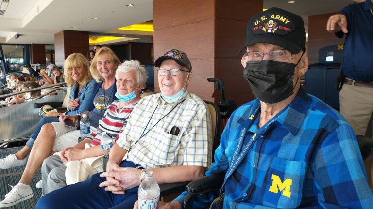 degraf sitting with family at game