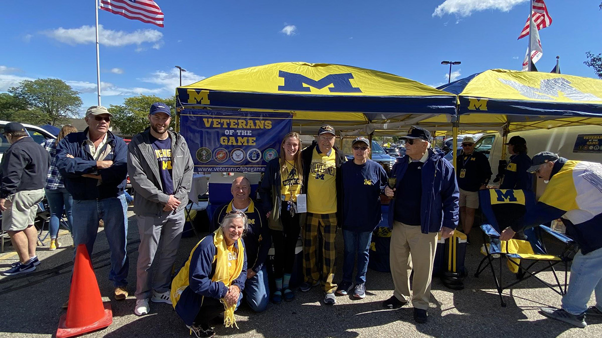 elfring and group in front of tent