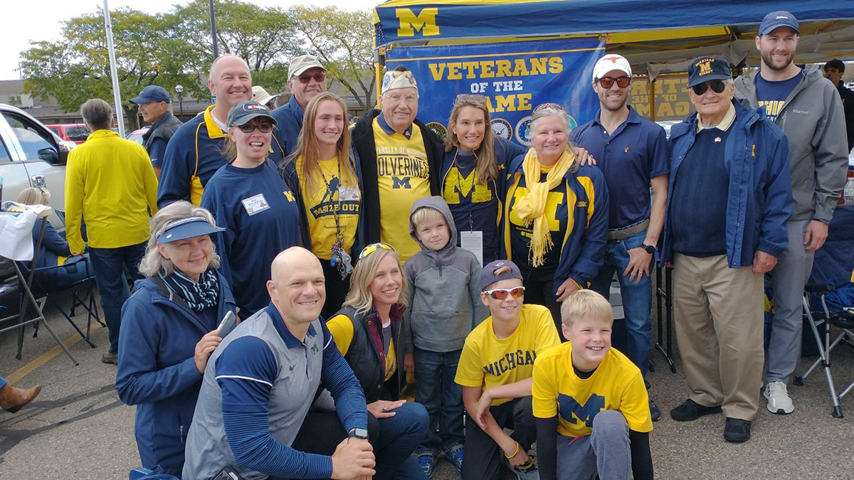 elfring and group in front of tent