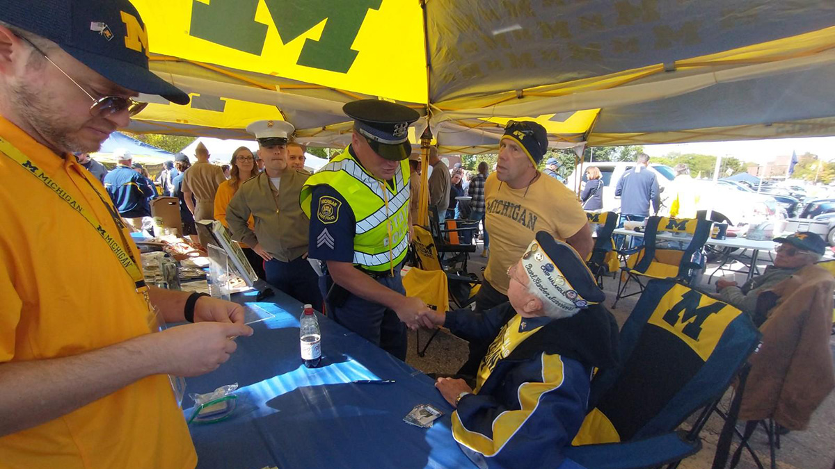 elfring shaking hands with policeman