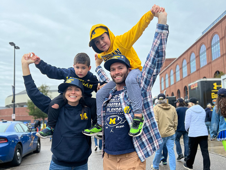 family with kids on sholders