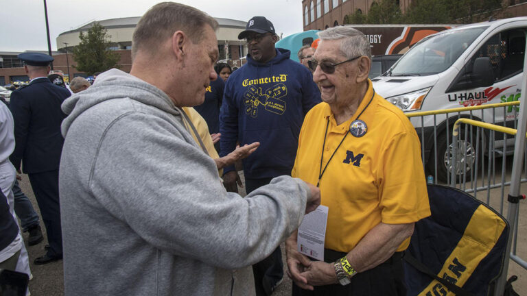 george speaking with gentleman