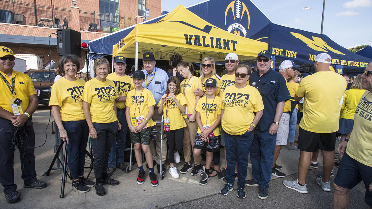 joe with group in yellow 2023 tshirts