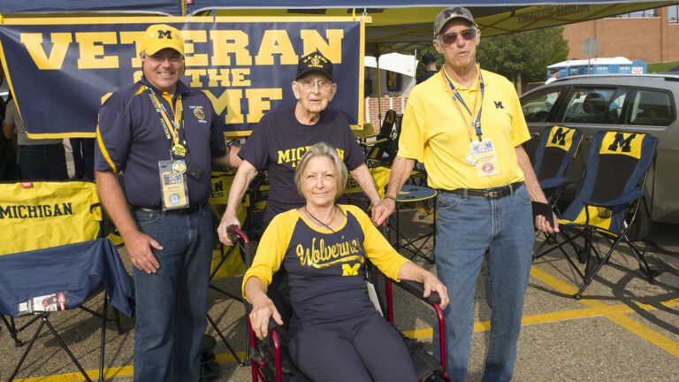 kluck with family and vog outside tent