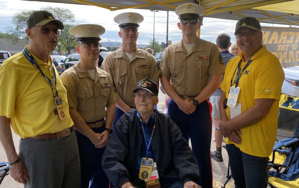 marines with veteran at tailgate